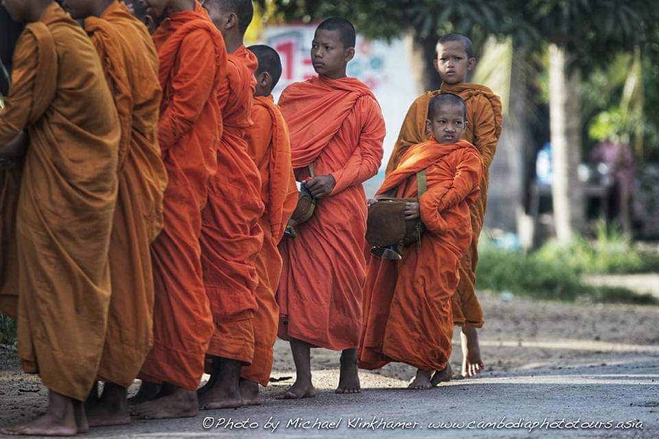 young boys buddhist alms collection cambodia