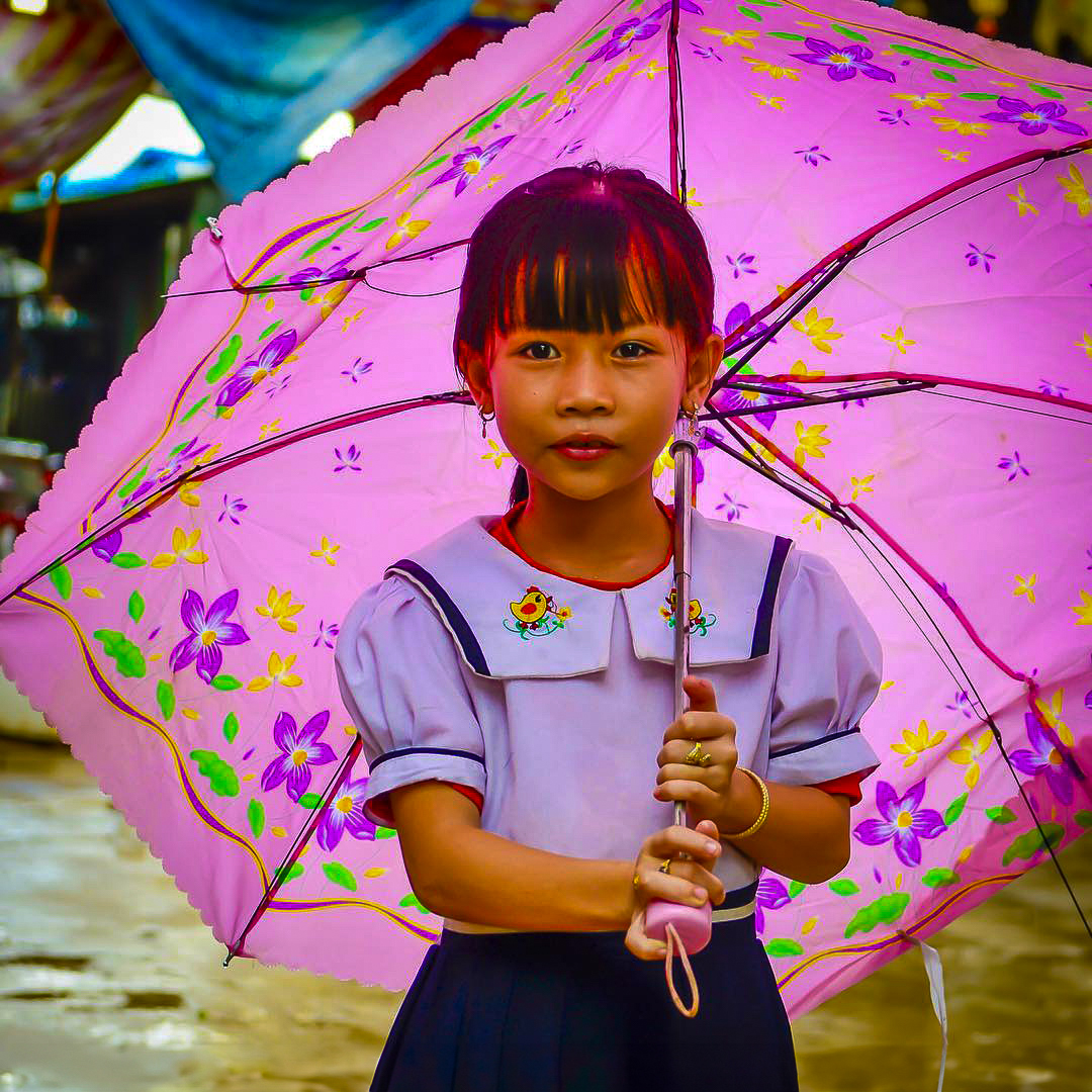 Cambodia Photo Tours girl with umbrella Phnom Penh