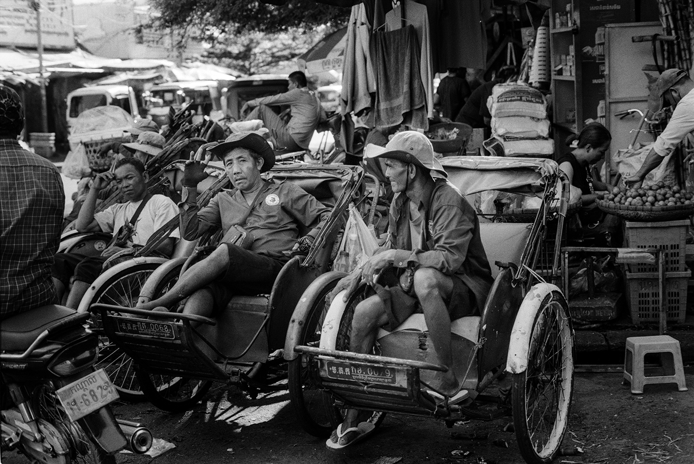 Phnom Penh Rickshaw riders near market 2023