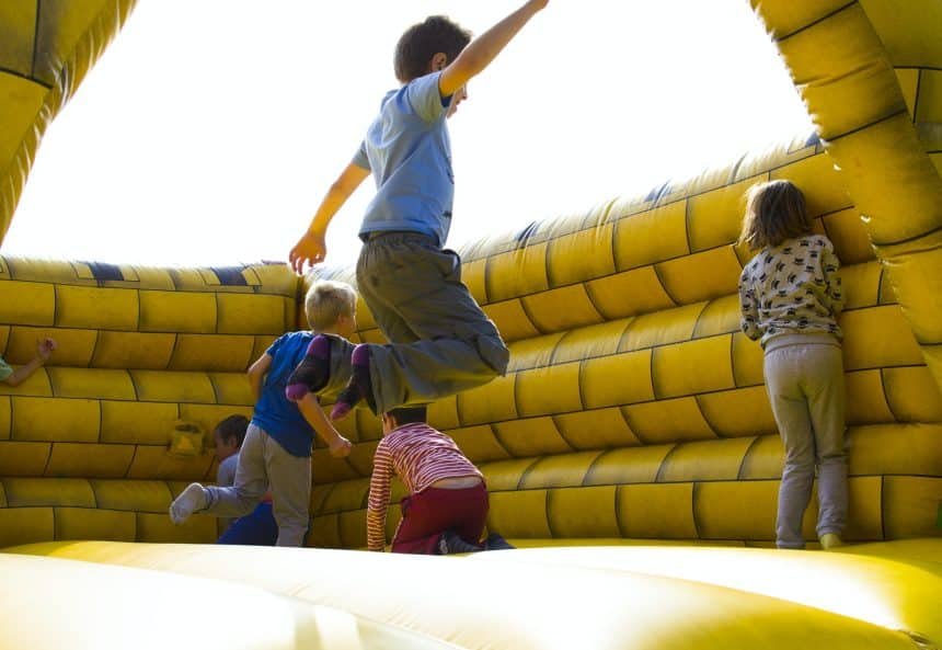 Children Playing on Inflatable Castle