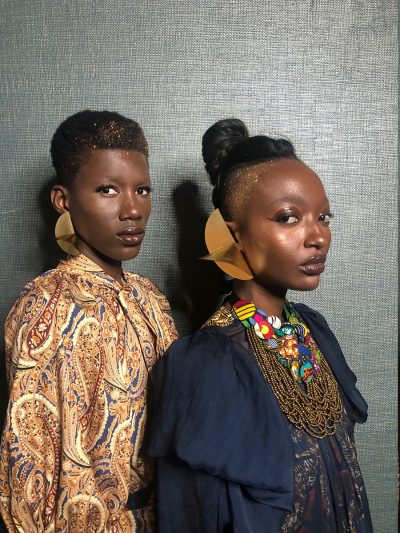 2 models backstage at designer Christie Brown's runway show at Glitz Fashion Week, Accra, Ghana