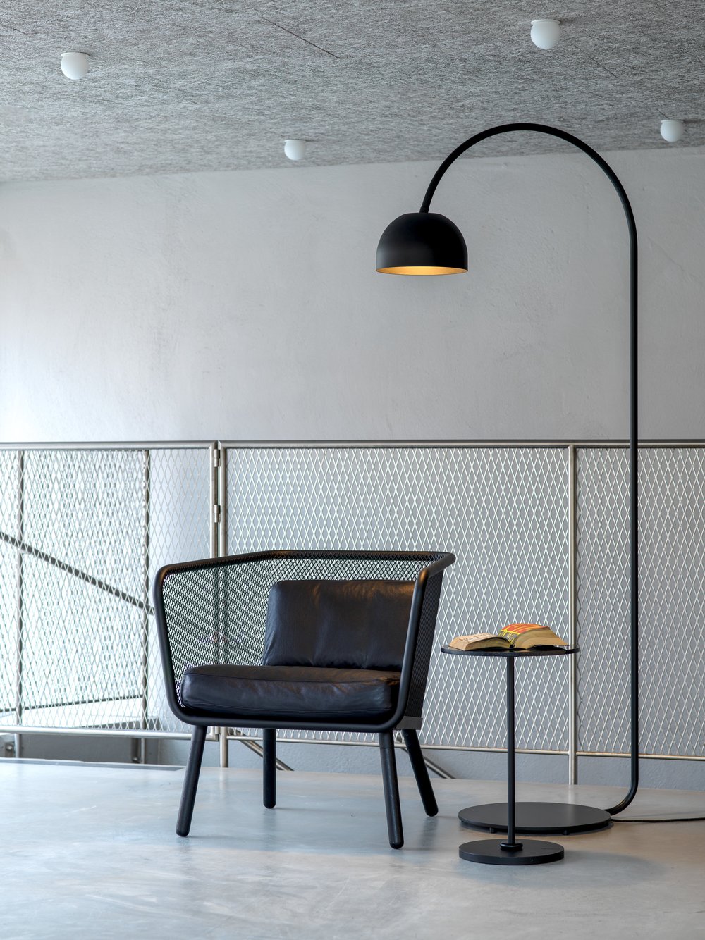 black bob floor next to black lounge stool