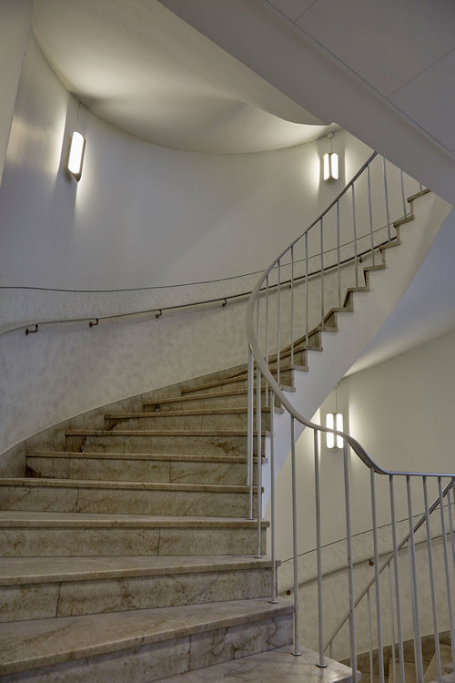 staircase with clark wall fixtures