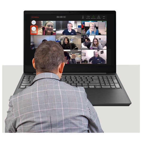 man sitting at a computer which has a zoom meeting