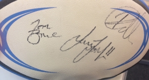 A rugby ball memorabilia signed by Leeds Rhinos squad