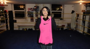 Britain's first female Muslim boxer, Ambreen Sadiq with a signed sports t-shirt to LMP