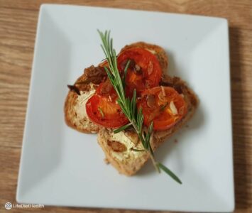 tomato toast on a white plate