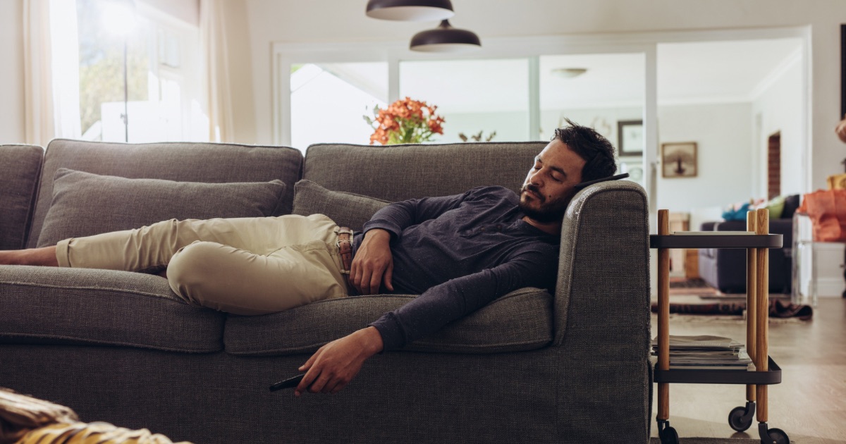 why does my husband sleep on the couch