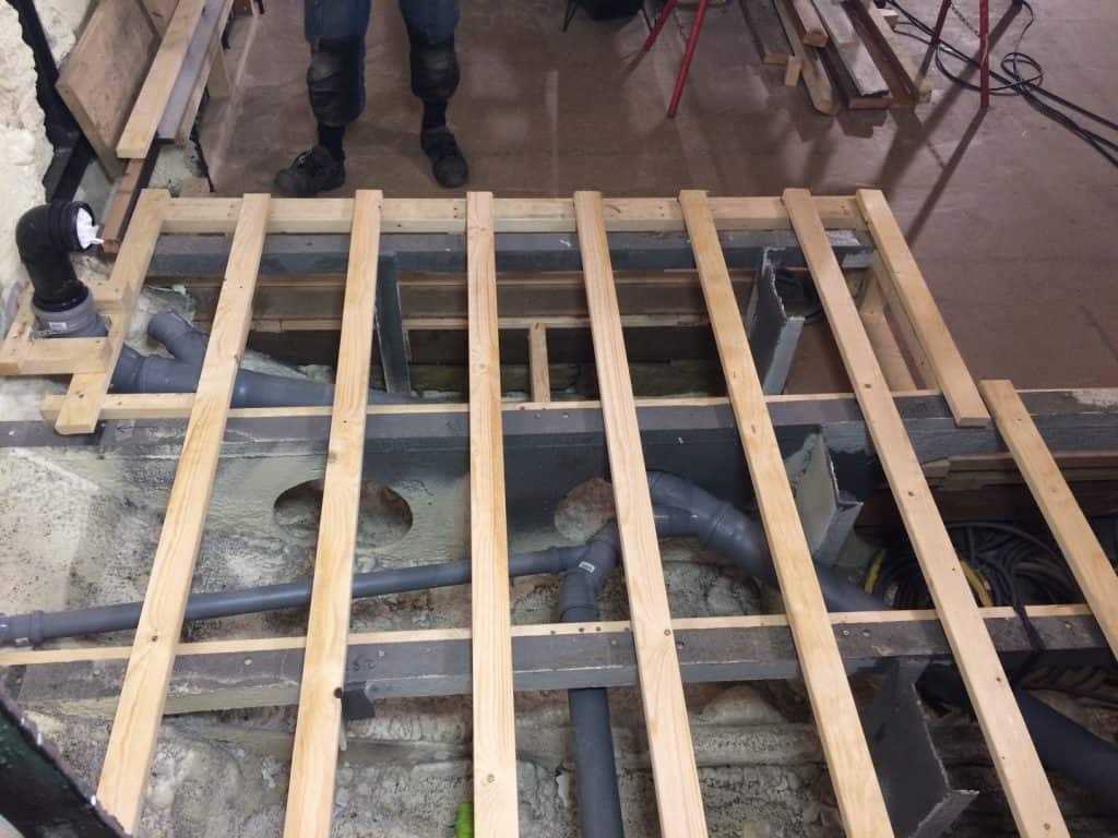 Sewage pipes and floor joists