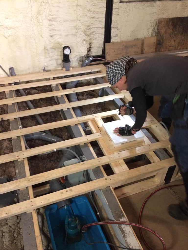 Mike is attaching the shower drain