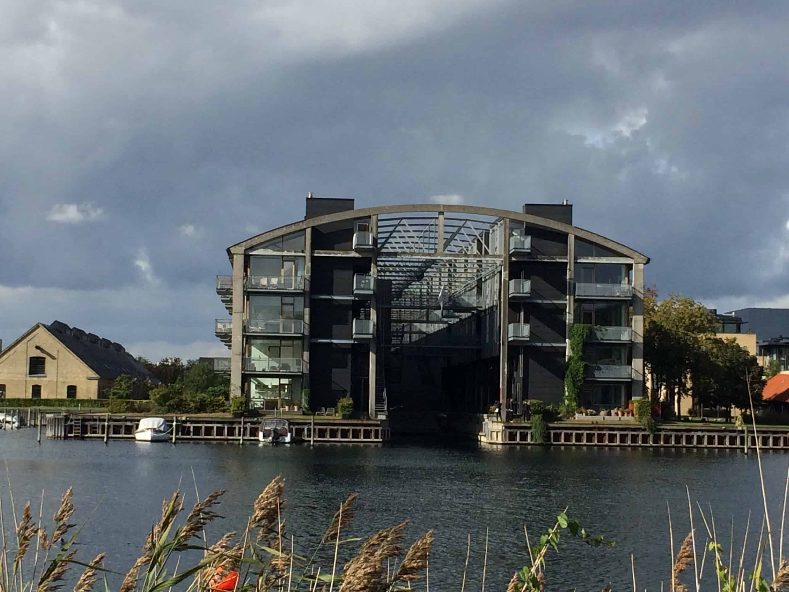 A big building with flats nest to the water