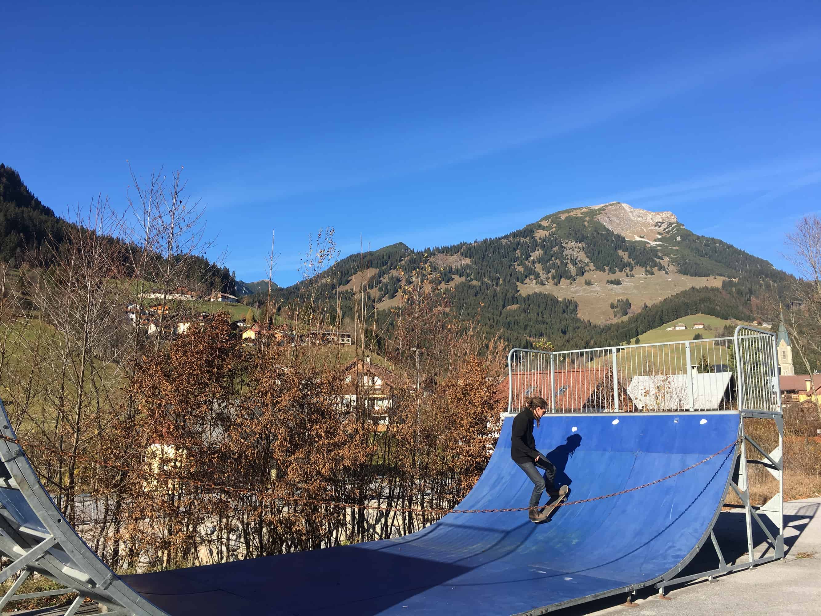 Mike is skateboarding in the Alps