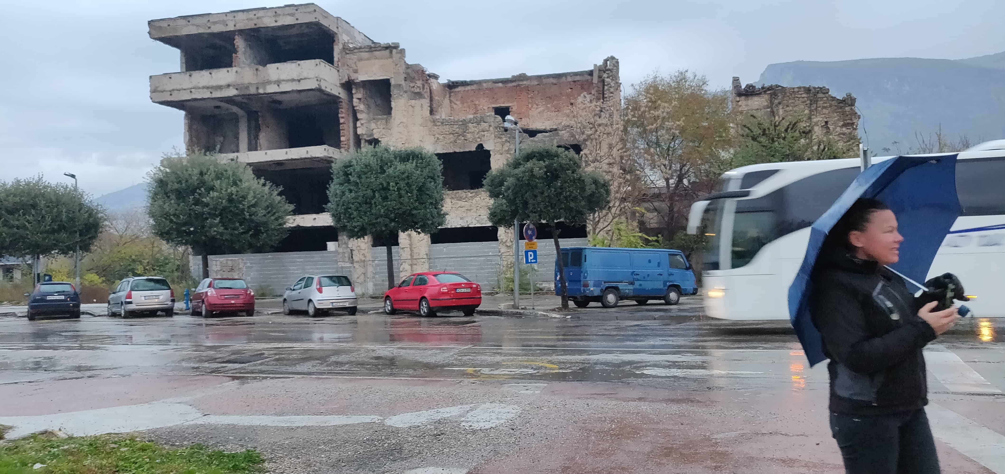 Me in front of a destroyed building