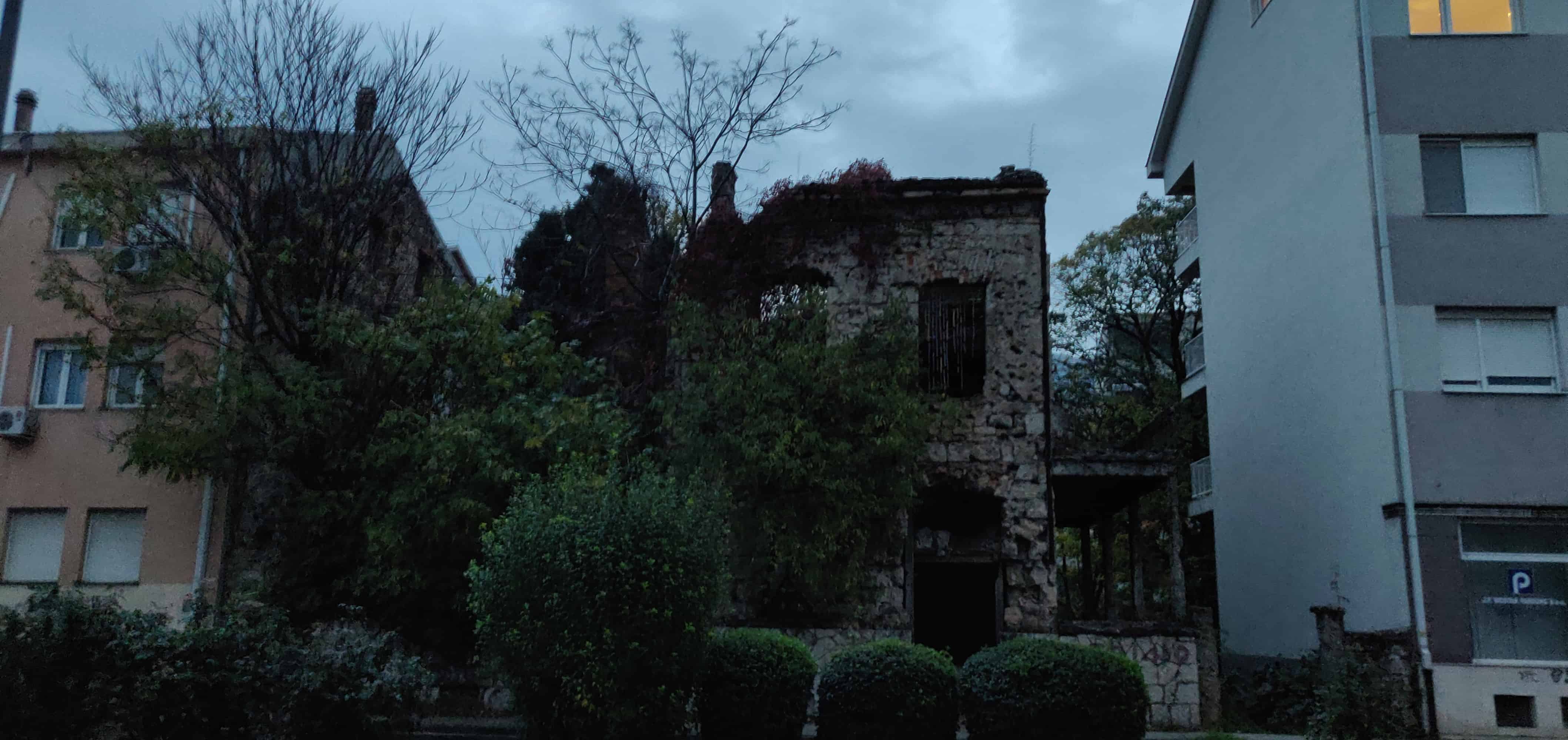 Destroyed building next to a renovated house