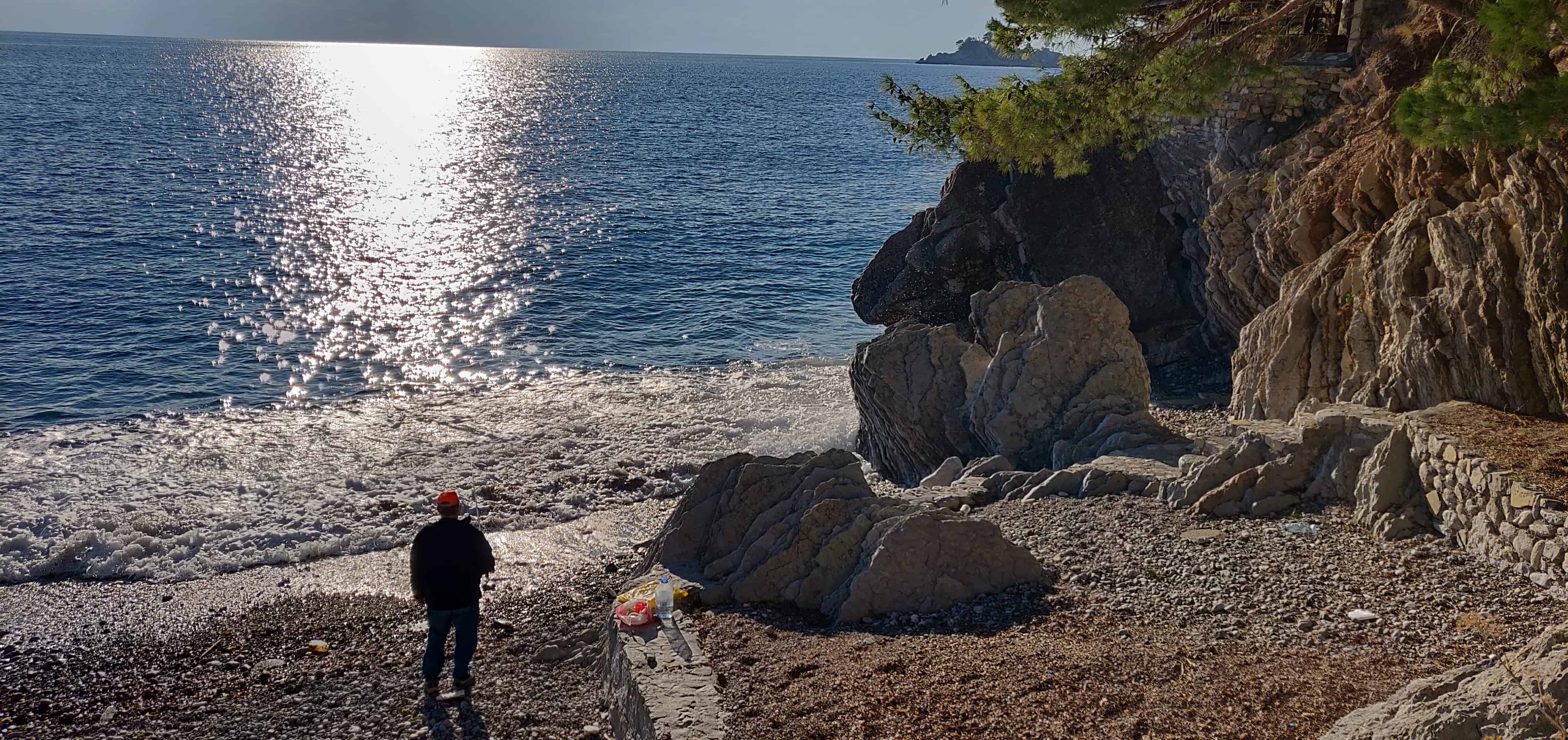 Someone fishing on a beautiful beach