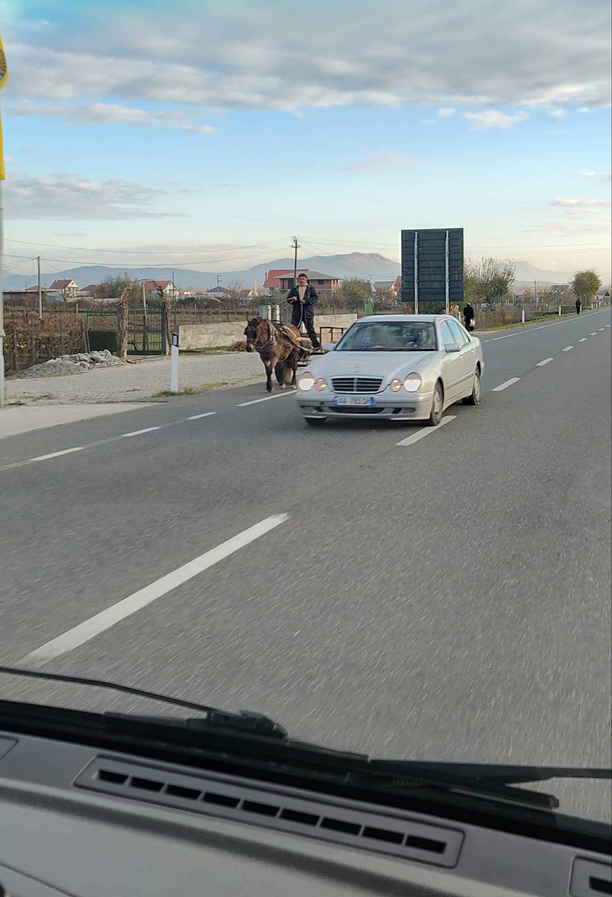 Horse and cart and Mercedes