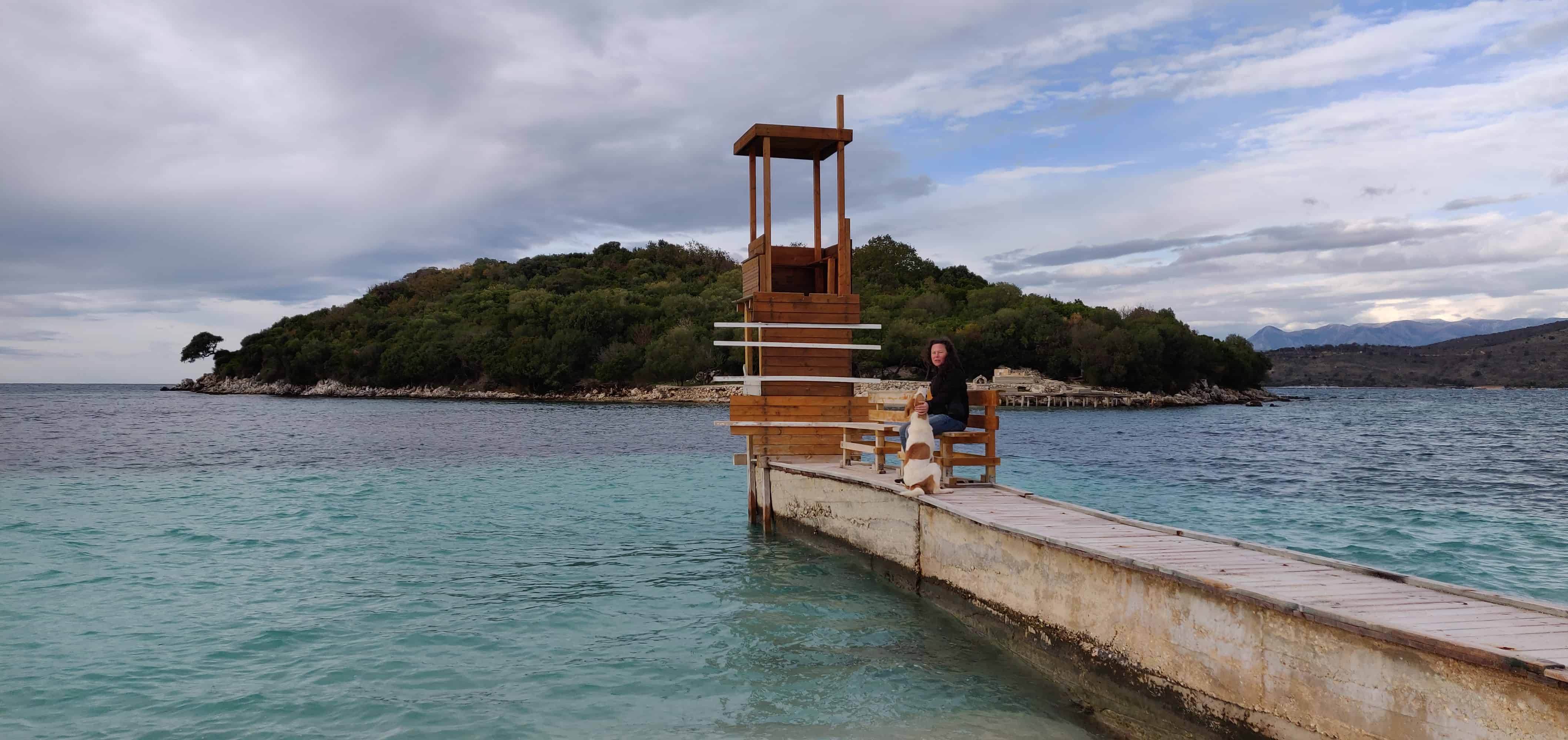 Me and one of the dogs. The biggest island of Ksamil in the background