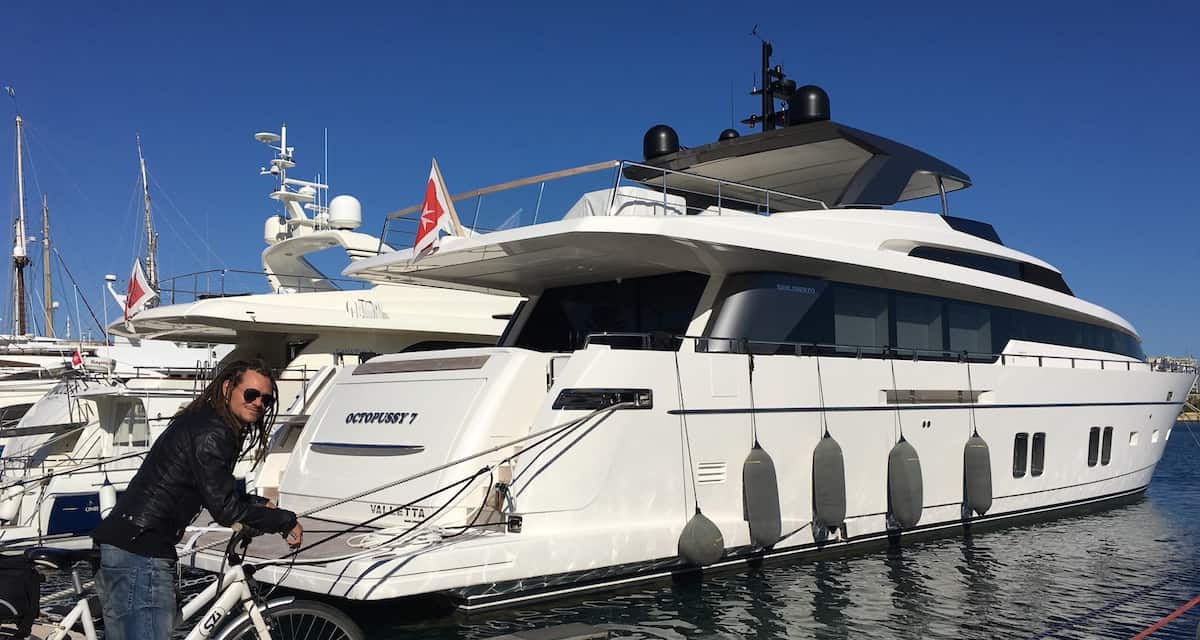 Mike in front of a big yacht