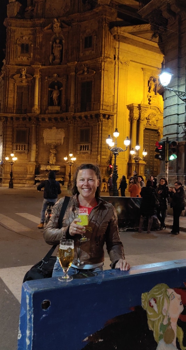 I'm having a beer on the street. Quattro Canti in the background