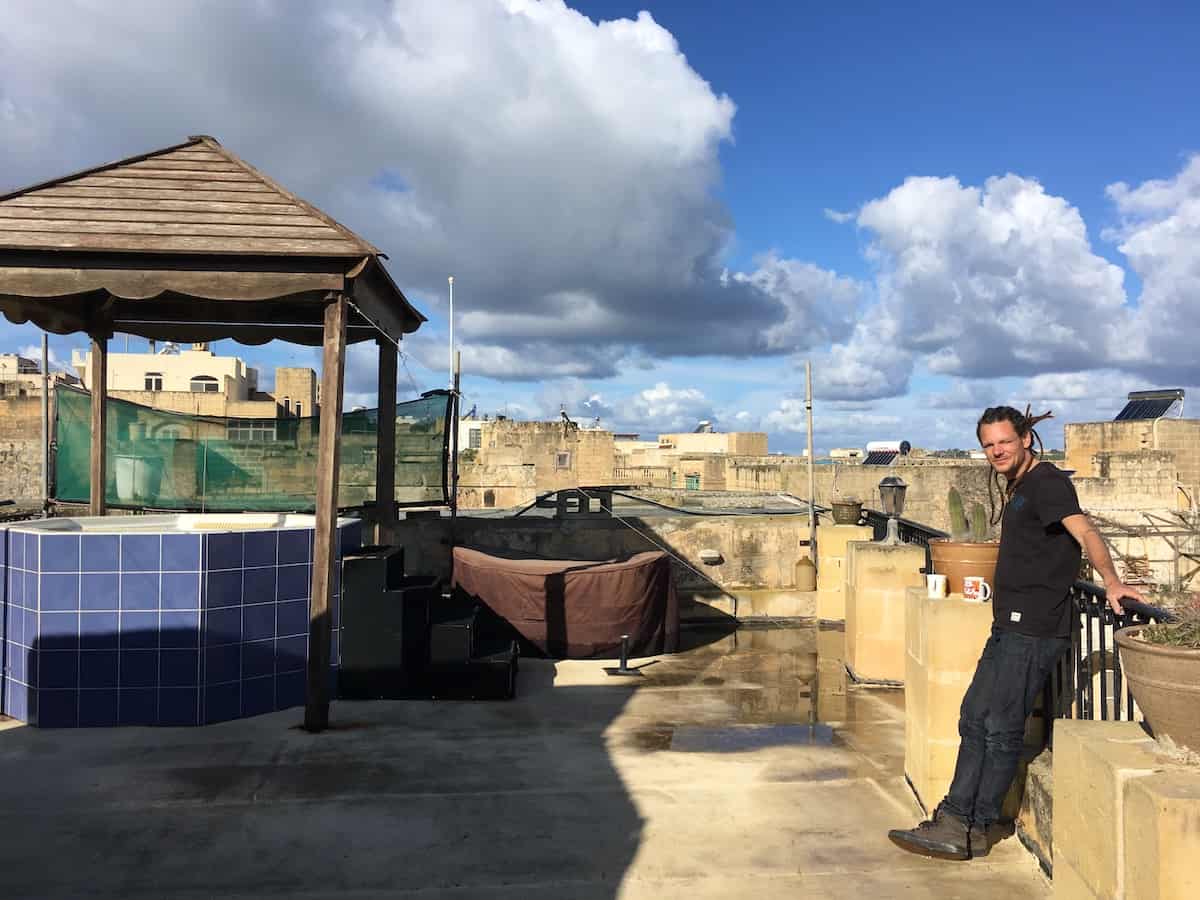 Mike on the rooftop at the house