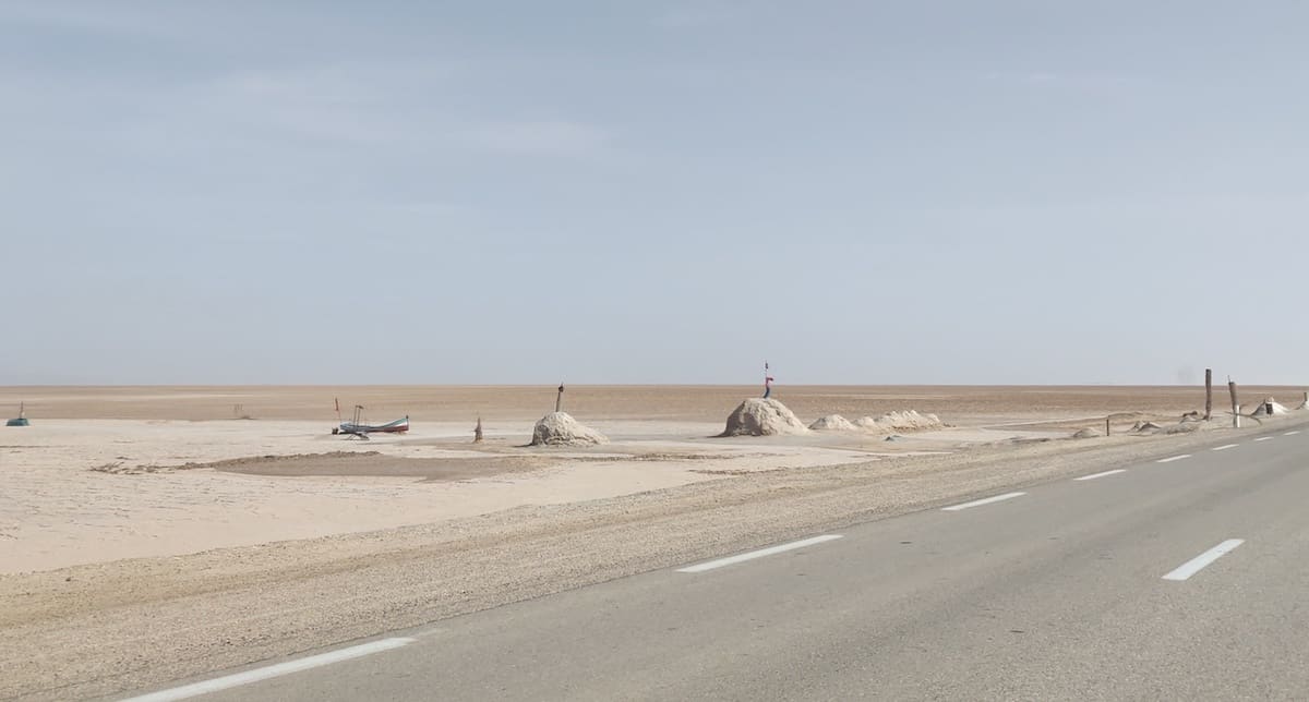 A boat and piles of salt at Chott el Djerid