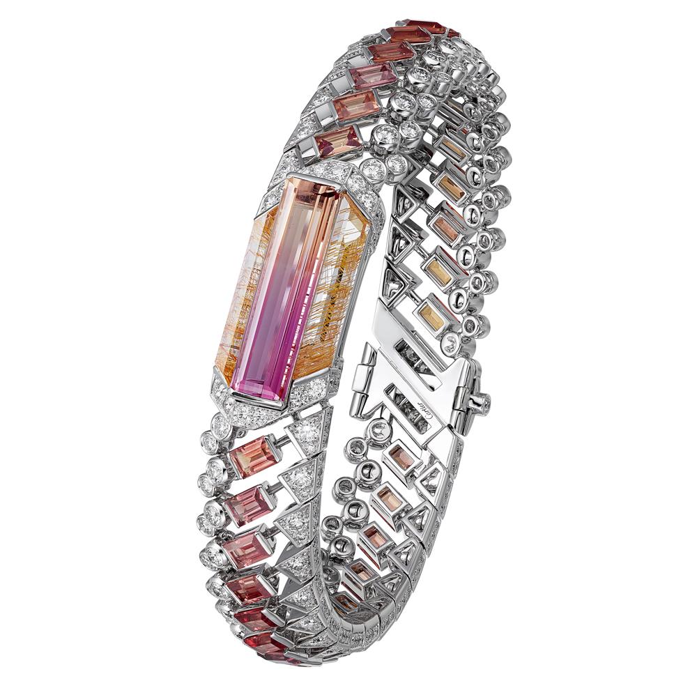 CARTIER Haute Joaillerie - Bracelet Magnitude de Cartier - Topaze Impériale bicolore rectangulaire (6,39 carats), saphirs taille baguette, quartz rutile, diamants.