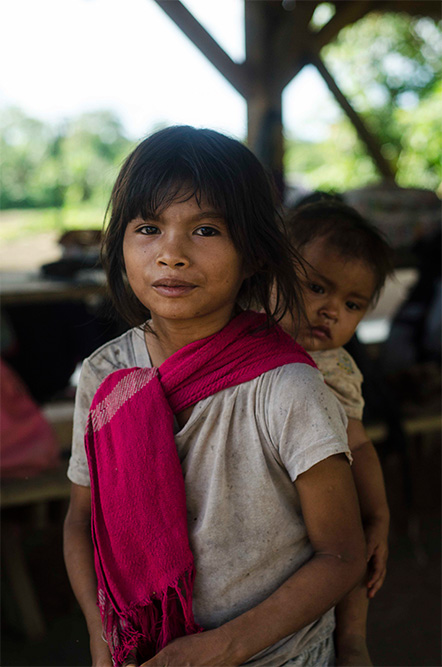 Ikiam foundation girl with baby in Ecuador