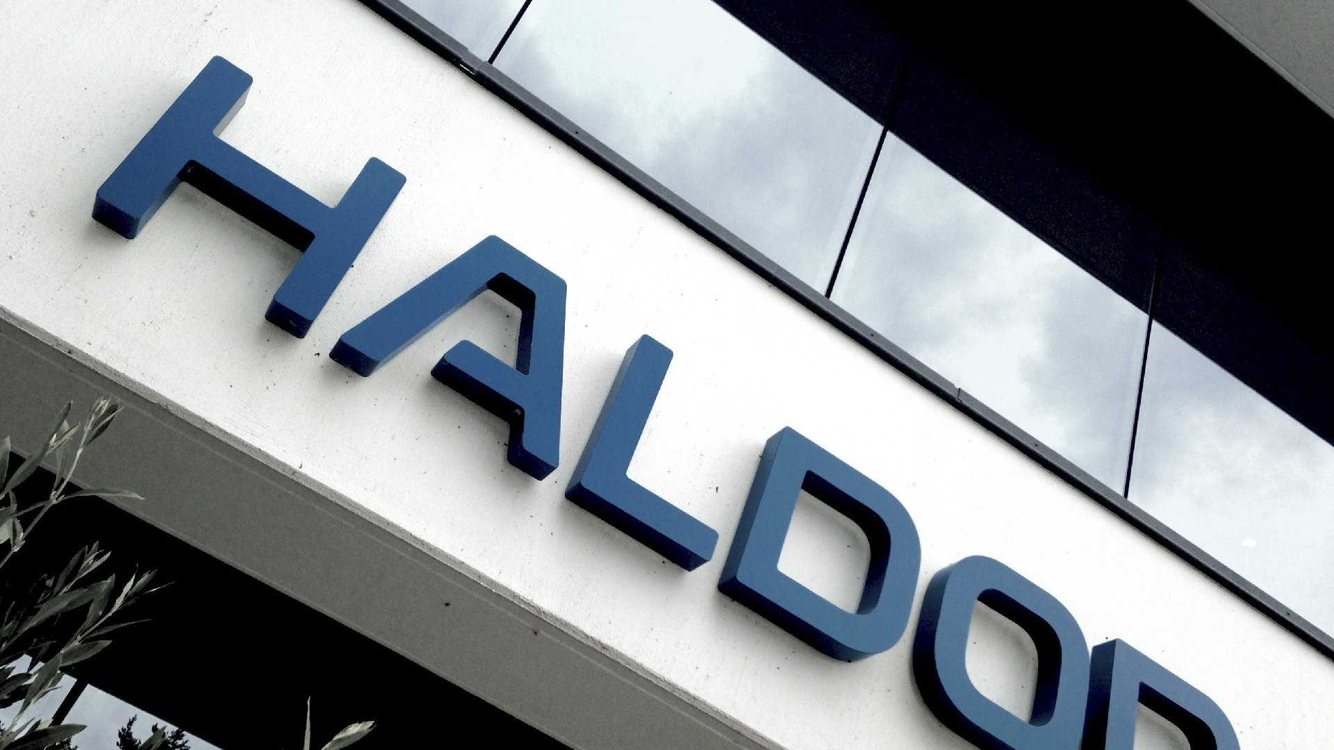 Haldor Topsøe logo on building by LOOP Associates