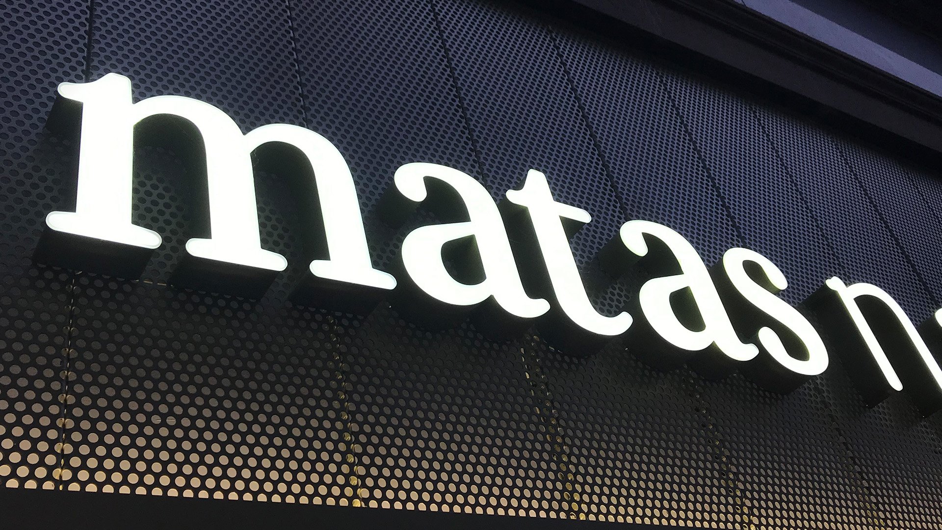 Matas logo on storefront by LOOP Associates