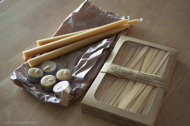 Beeswax candles and pappardelle pasta.