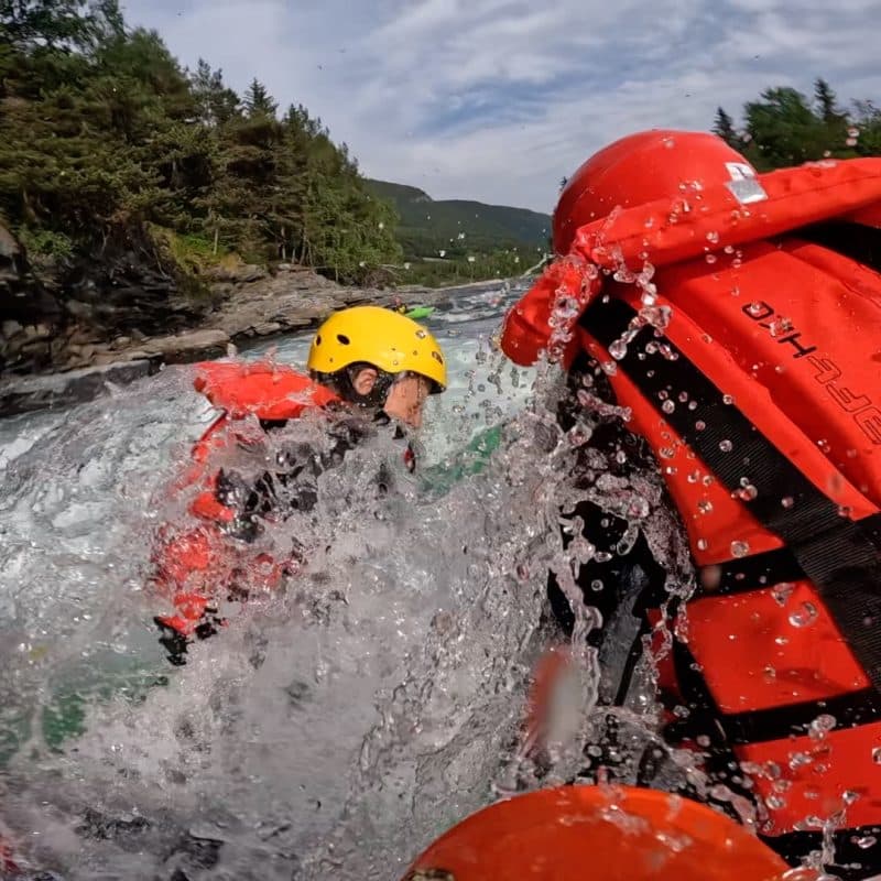 Group of whitewater rafters in Sjoa going through a wave