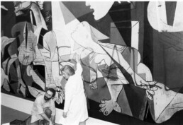 Museum of Modern Art Employees clen spray paint off of Guernica