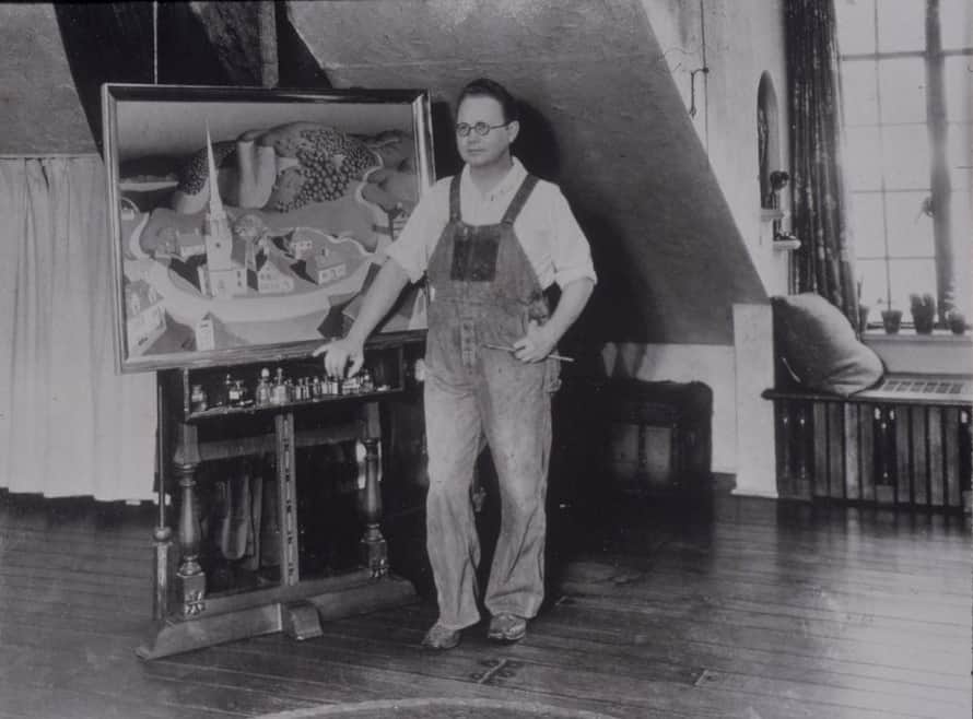 Grant Wood posing in his studio, ca. 1931. Photo credit: Cedar Rapids Museum of Art. American Gothic