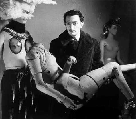 Dalì holding a mannequin, International Surrealist Exhibition, Paris, 1938. Photo: Denise Bellon