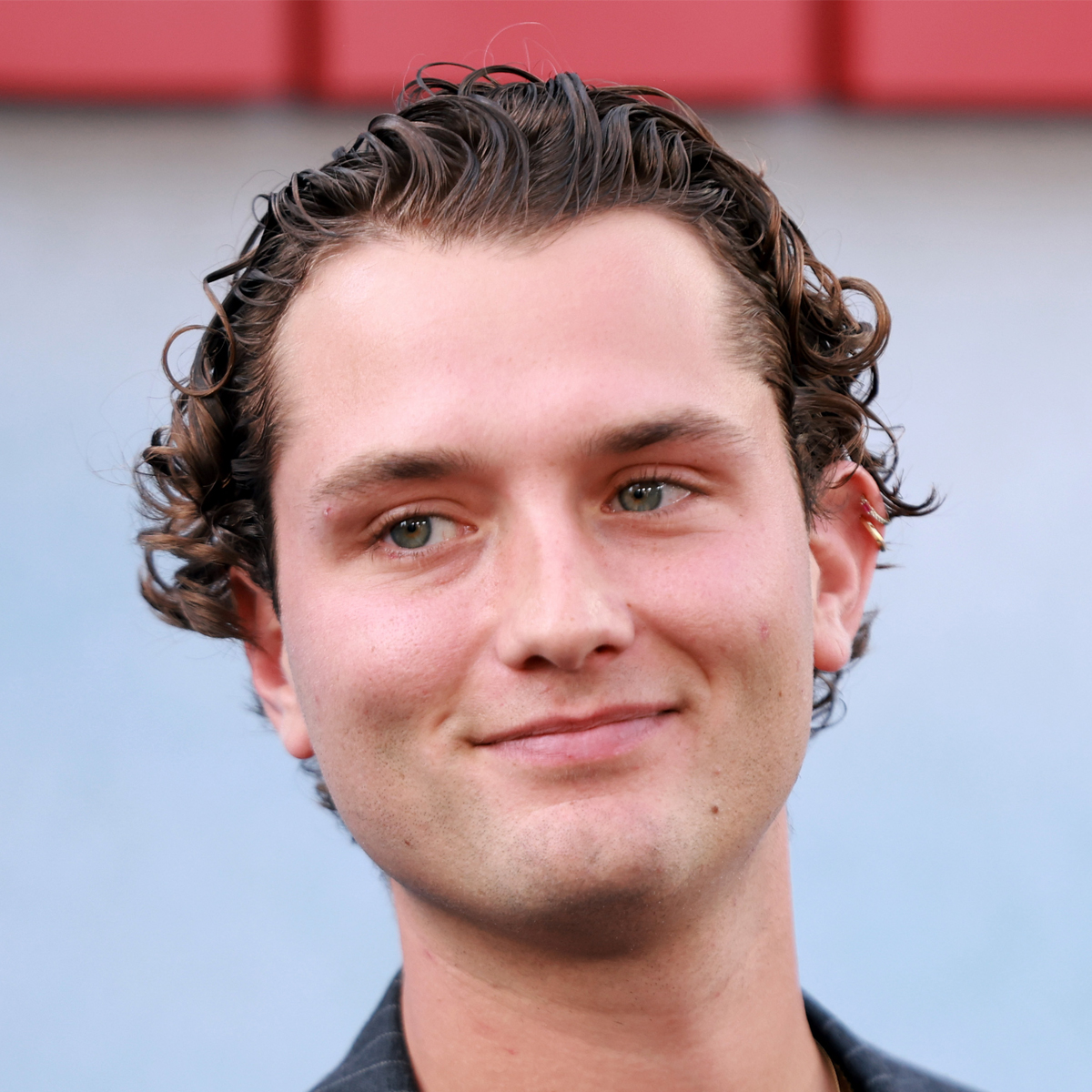 Raff Law’s hair - slicked back curly hairstyle