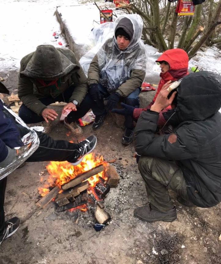 campfire in calais refugee camps