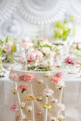 Spring chairback flower waterfall. Photo by Marianne Taylor & flowers by Fairynuffflowers. Click through to see more.