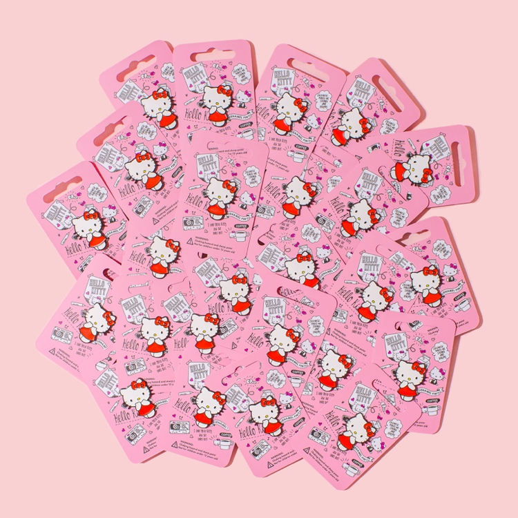 Colourful product photography and styling of Hello Kitty pins by Marianne Taylor.