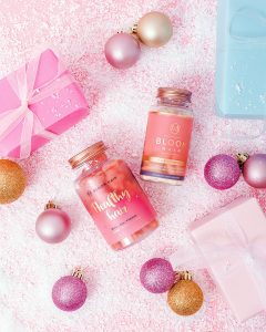 Pink stills Christmas content creation for Bloom Hair vitamins. Styled health product stills photography by Marianne Taylor.