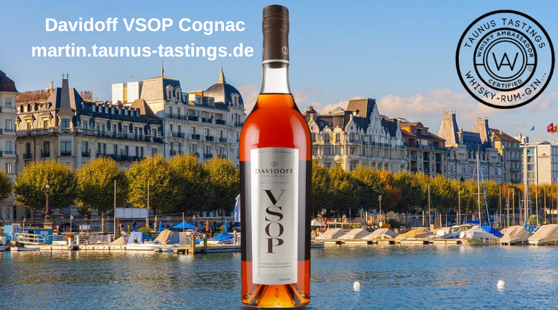 Eine Flasche Davidoff VSOP Coganc, im Hintergrund eine Ansicht von Genf