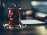 close up photo of steaming black tea in glass