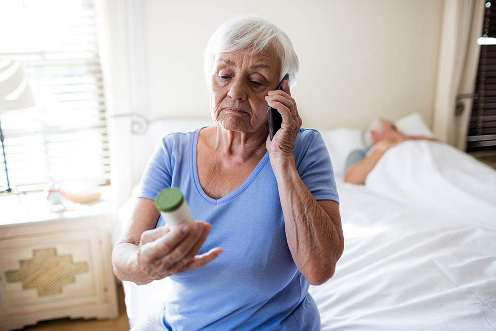 Older lady on phone wondering about medicine