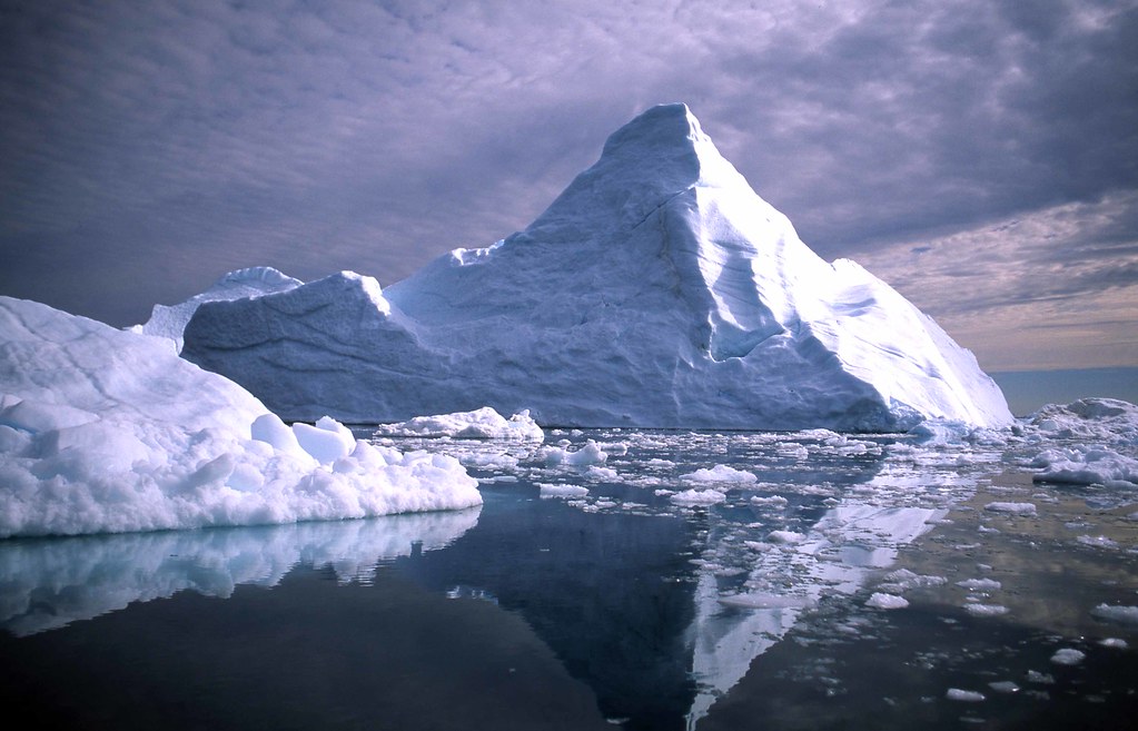 iceberg melting in the ocean.