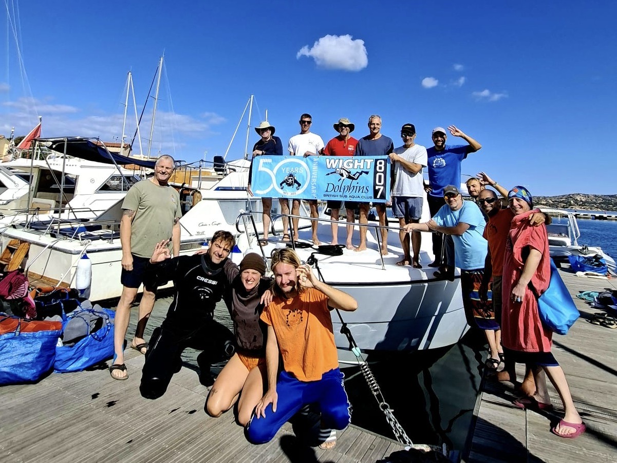 Group photo on a boat dock.