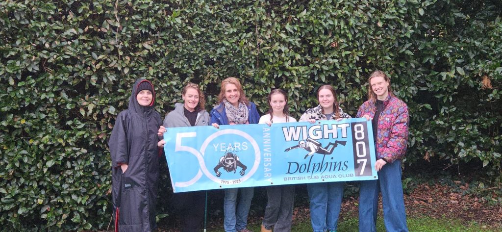 Group celebrating 50 years of Dolphins