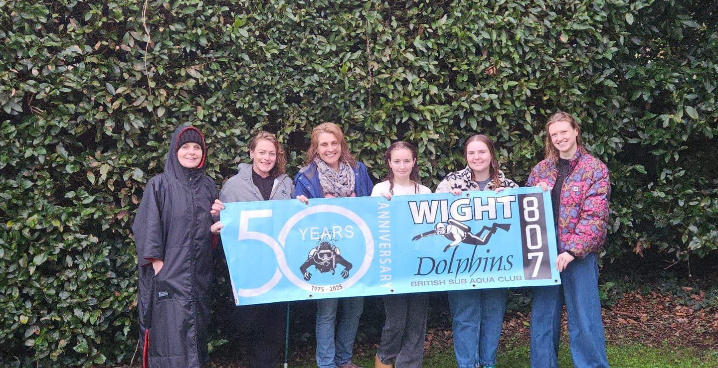Group celebrating 50 years of Dolphins
