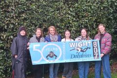 Group celebrating 50 years of Dolphins