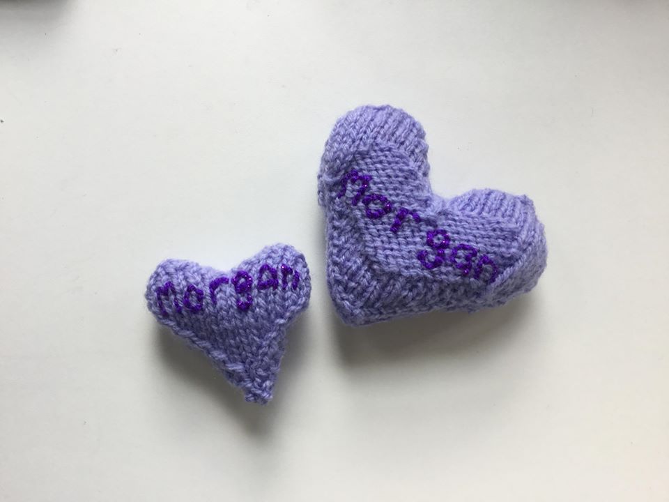 Two knitted hearts to commemorate miscarried baby