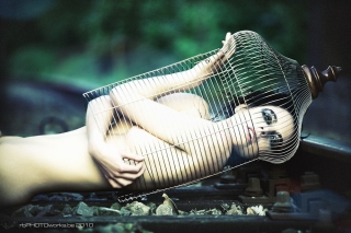 Kept in a cage Model kept in a cage on railway
