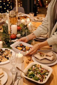 Deck the Halls (and the Kitchen)! A Real-Life Mallorcan Holiday Tale 11 Elegant holiday dinner table with festive decor and delicious dishes being served.